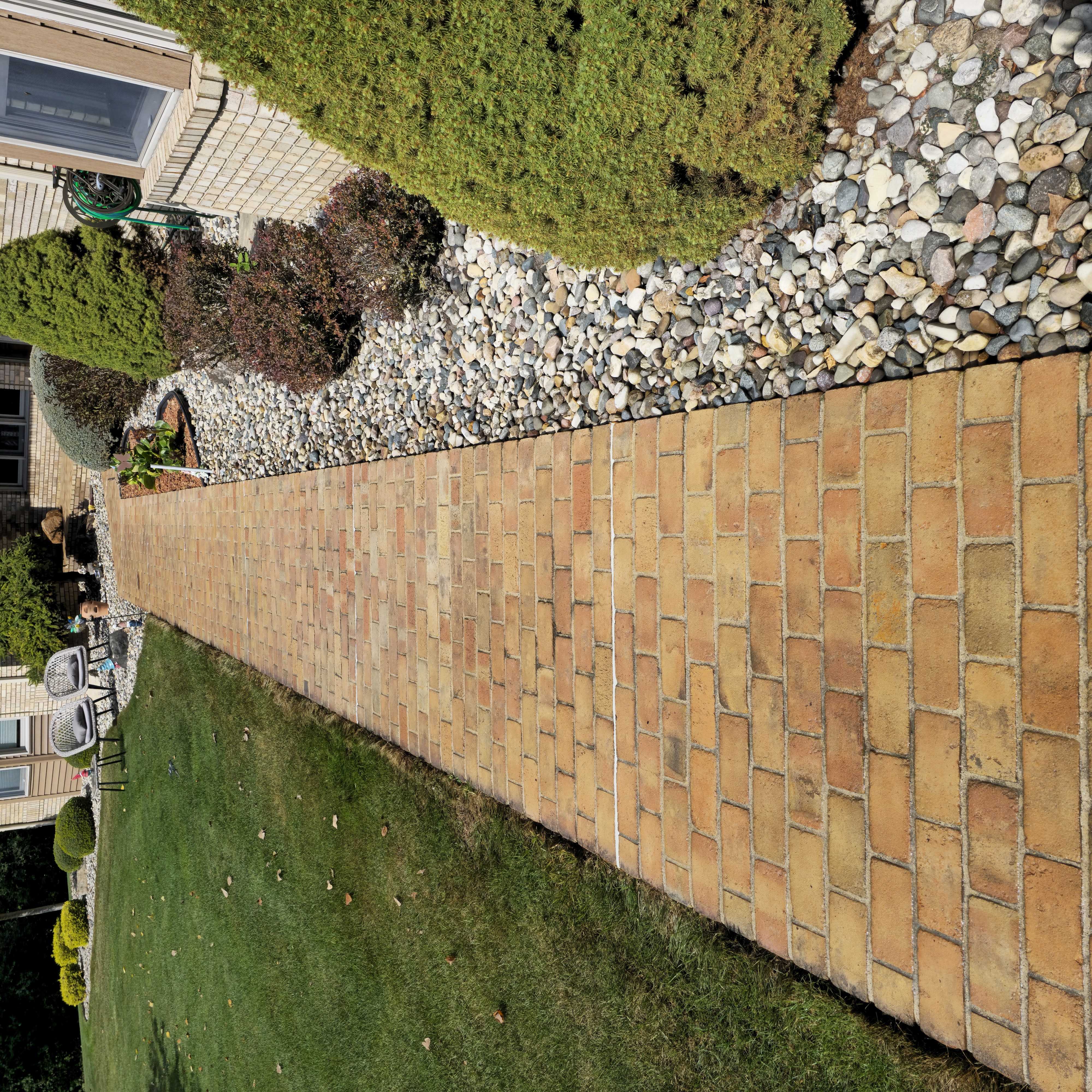Brick walkway after pressure washing - vibrant clean bricks