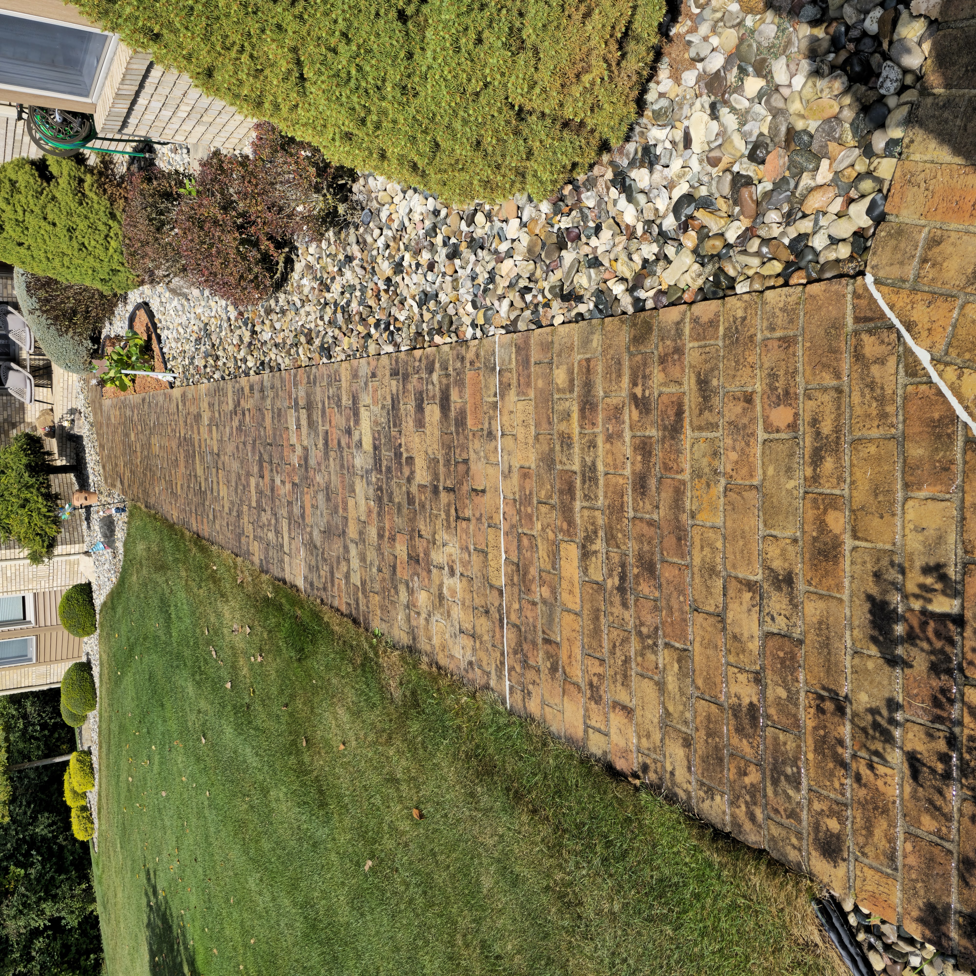 Brick walkway before pressure washing - stained and dirty
