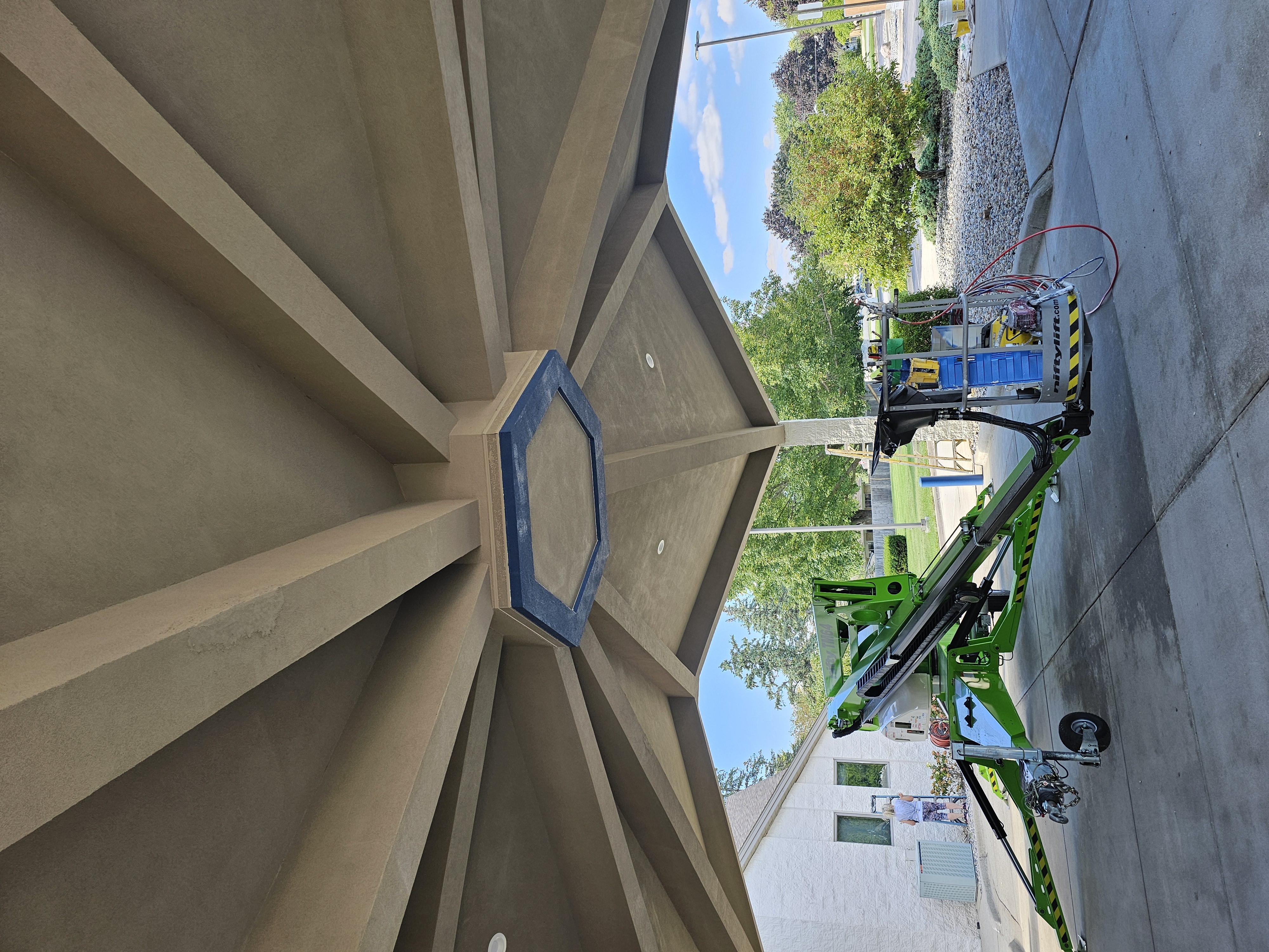 Commercial painting with lift equipment